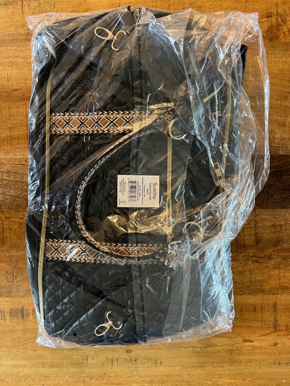 Quilted Black Travel Bag with Embroidered Accent